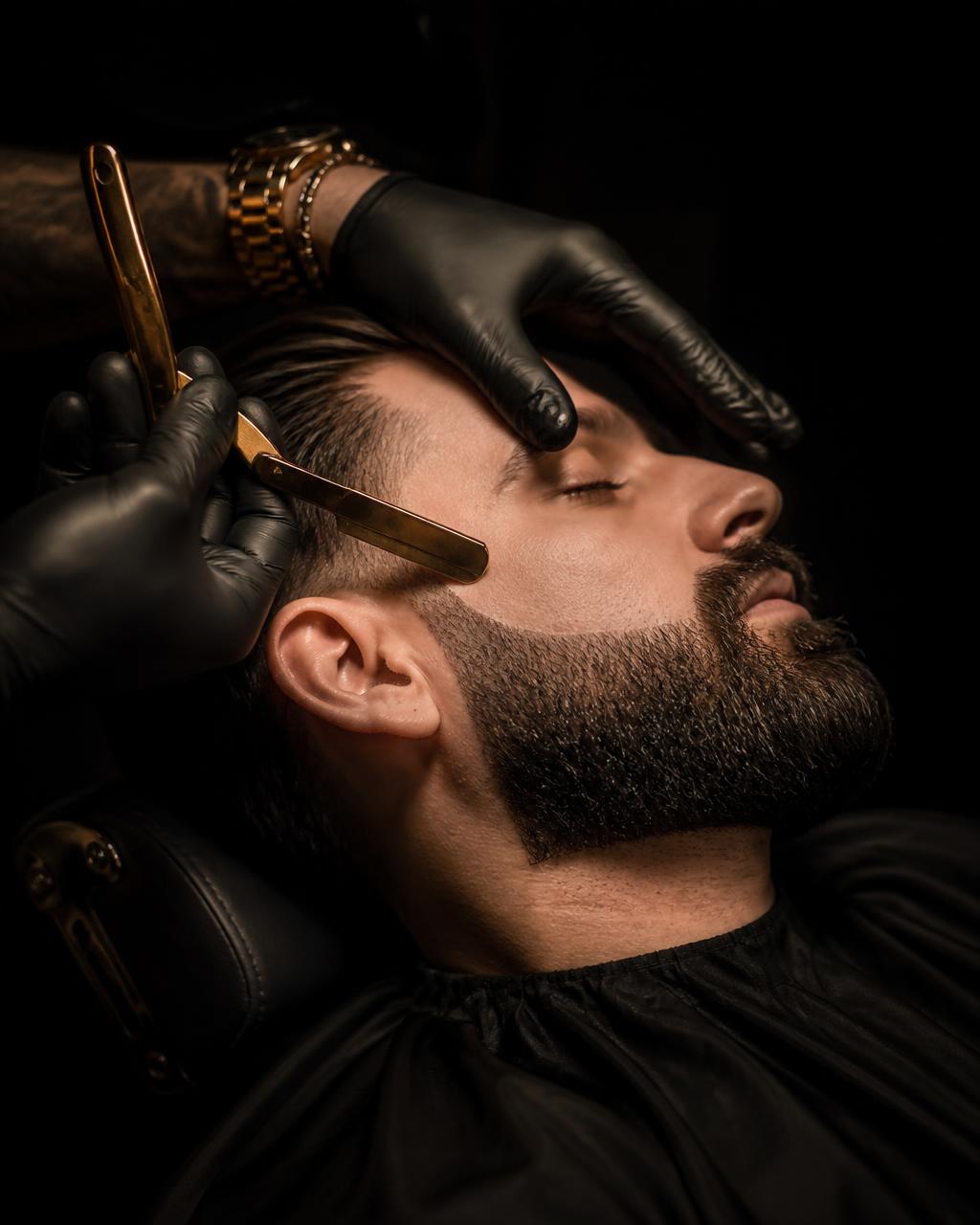 Barber sculpting a beard with a straight razor